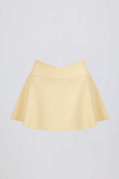 Minifalda pantalón cruzada de jersey cepillado en color limón jaspeado