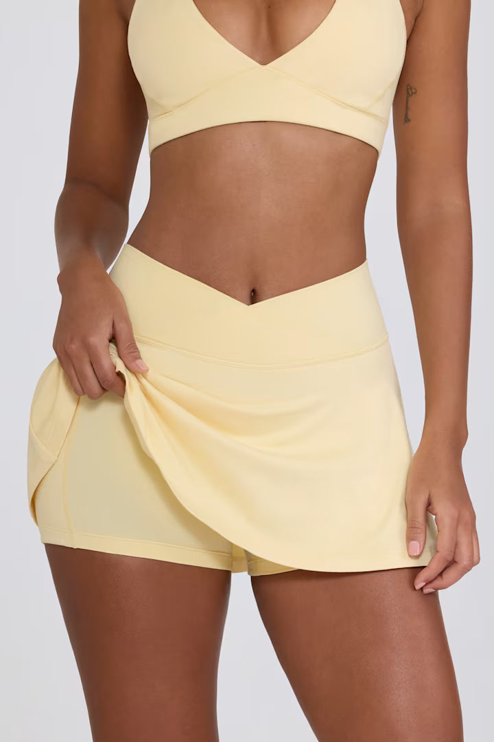 Minifalda pantalón cruzada de jersey cepillado en color limón jaspeado