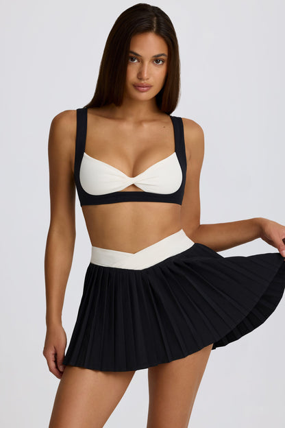 Minifalda pantalón cruzada plisada Soft Active en negro