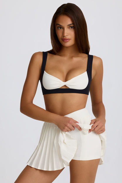 Minifalda pantalón cruzada plisada Soft Active en malvavisco