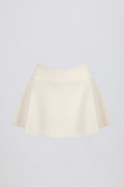 Minifalda pantalón cruzada de jersey cepillado en vainilla